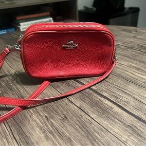 Coach mini cross-body bag in red.